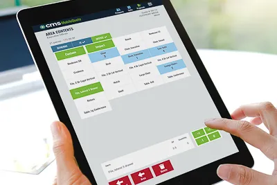 Hands holding tablet displaying CMS MobileQuote Commercial Moving Cost Estimator